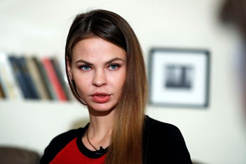 A Belarusian model who claims to have information tying Russia to Donald Trump's election campaign says she has since turned that material over to Russian billionaire businessman Oleg Deripaska.