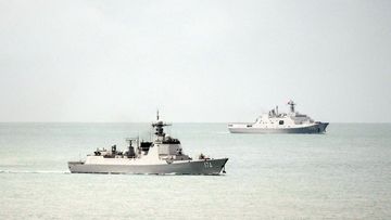 Chinese Luyang-class guided-missile destroyer (left) and Yuzhao-class amphibious transport dock vessel