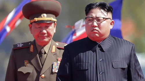 General Hwang Pyongo-so and Kim Jong-un. (AAP)