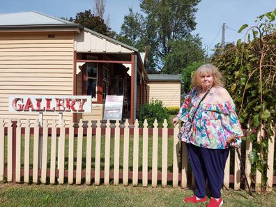 Judith Lipp poses outside a gallery.