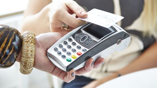 Aussies are struggling to save, and tap and go cards may be partly to blame. (AAP)