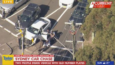The chase ended when the car crashed into a traffic light pole near a school and shopping centre at North Rocks in the north-west.