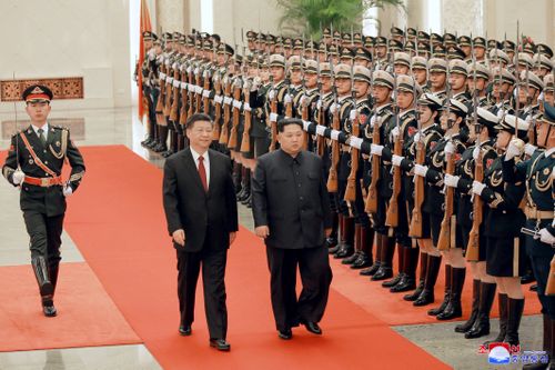 Kim Jong-un and Xi Jinping officially inspect the troops as part of their ceremonial duties. Picture: AAP
