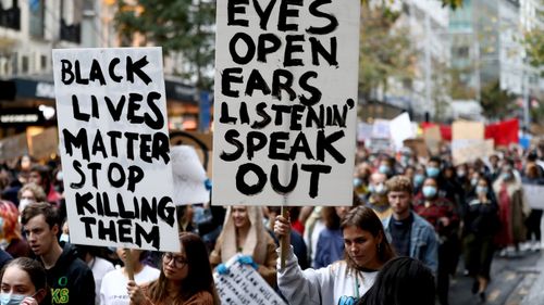 Protestors march down Queen Street on June 01, 2020 in Auckland, New Zealand. The rally was organised in solidarity with protests across the United States.