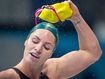 Triple gold-winning Olympic swimming star hangs up her goggles