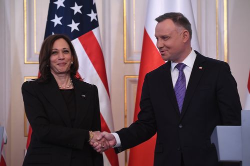 Polish President Andrzej Duda, right, shakes hands with US Vice President Kamala Harris on the occasion of their meeting at Belwelder Palace, in Warsaw, Poland, Thursday, March 10, 2022