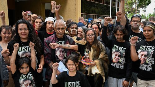 Percy Lovett and Aunty Donna Nelson with family, friends and supporters of Veronica Nelson after the findings were handed down.