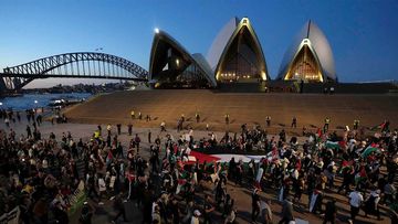 Palestine supporters rally outside the Sydney Opera House.