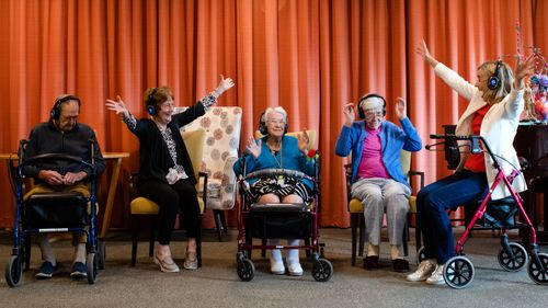 A group of pensioners enjoy a silent disco at Glades Bay Gardens nursing home, in New South Wales, Australia.