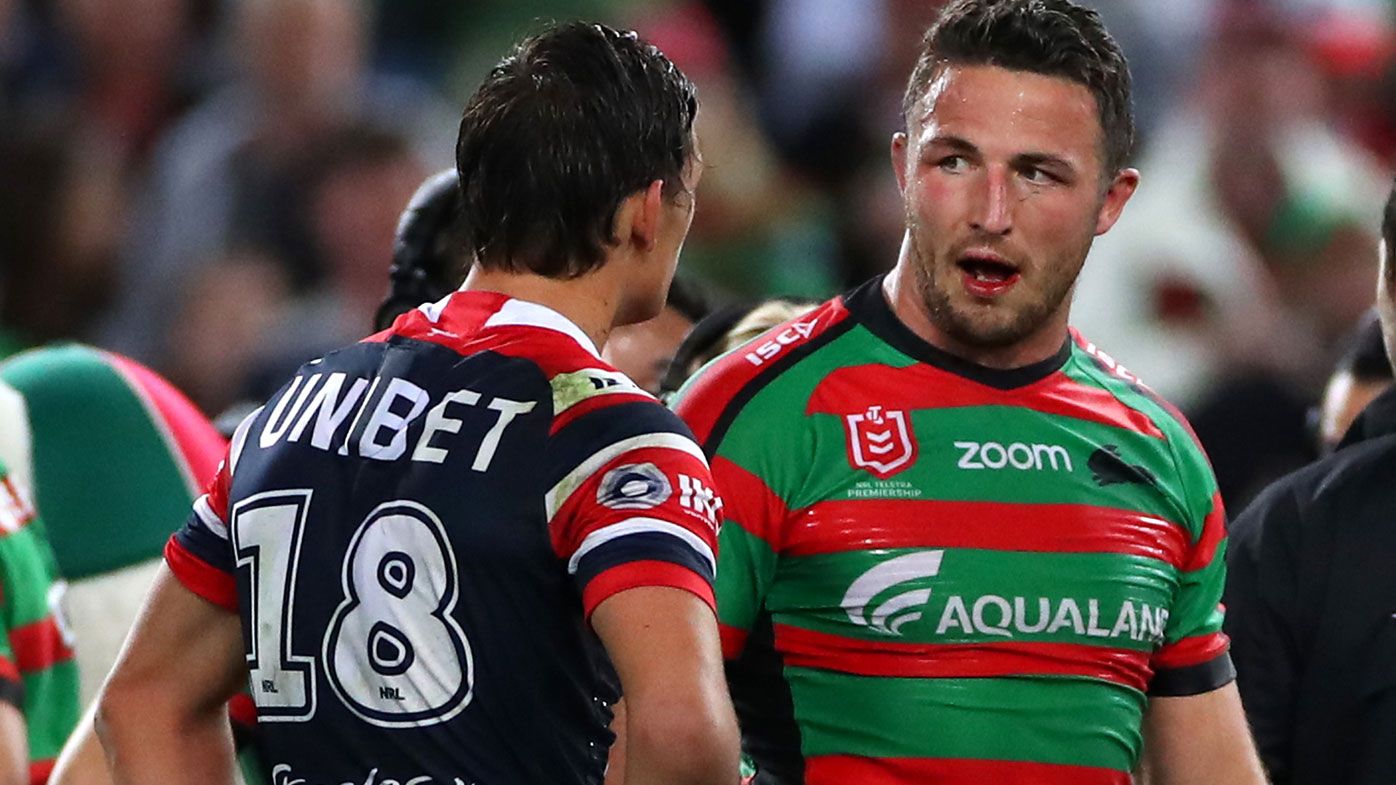 Sam Burgess of the Rabbitohs exchanges words with Billy Smith
