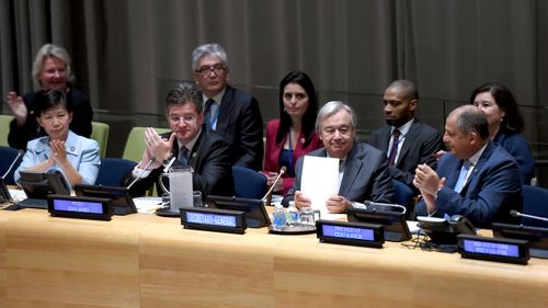 United Nations Secretary-General António Guterres (second from the right) is applauded after opening the Signing Ceremony for the Treaty on the Prohibition of Nuclear Weapons. (AFP)