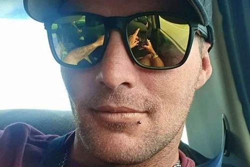 Dean Cluney has been charged with domestic violence offences after his girlfriend and three children died in a car crash.