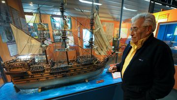 Treasure hunter Ruben Collado with a scale model of British warship, the Lord Clive. (Getty)