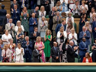 The Royal Box stands and applauds Oxford University and Astra Zeneca scientist and one of the people behind the successful COVID-19 vaccine Professor Sarah Gilbert (seats in red) ahead of the opening match on Centre Court at The Championships 2021. Held at The All England Lawn Tennis Club, Wimbledon.  Day 1 Monday 28/06/2021. Credit: AELTC/Joe Toth