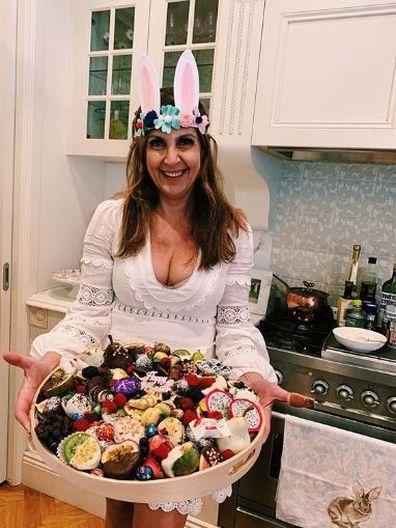 Greek woman holds desserts usually consumed on Greek Easter.