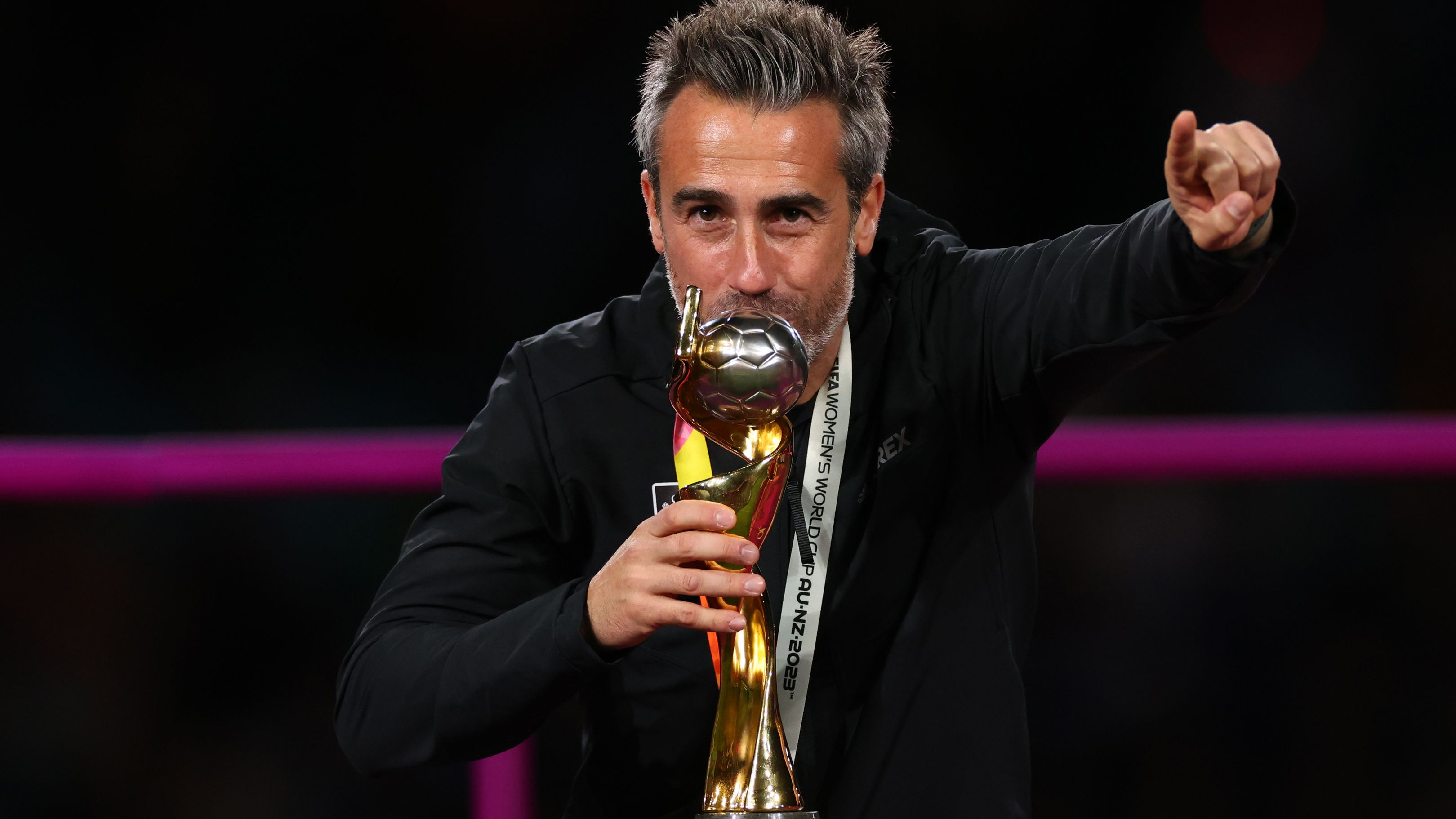 Jorge Vilda celebrates by kissing a trophy after Spain won the FIFA Women&#x27;s World Cup.