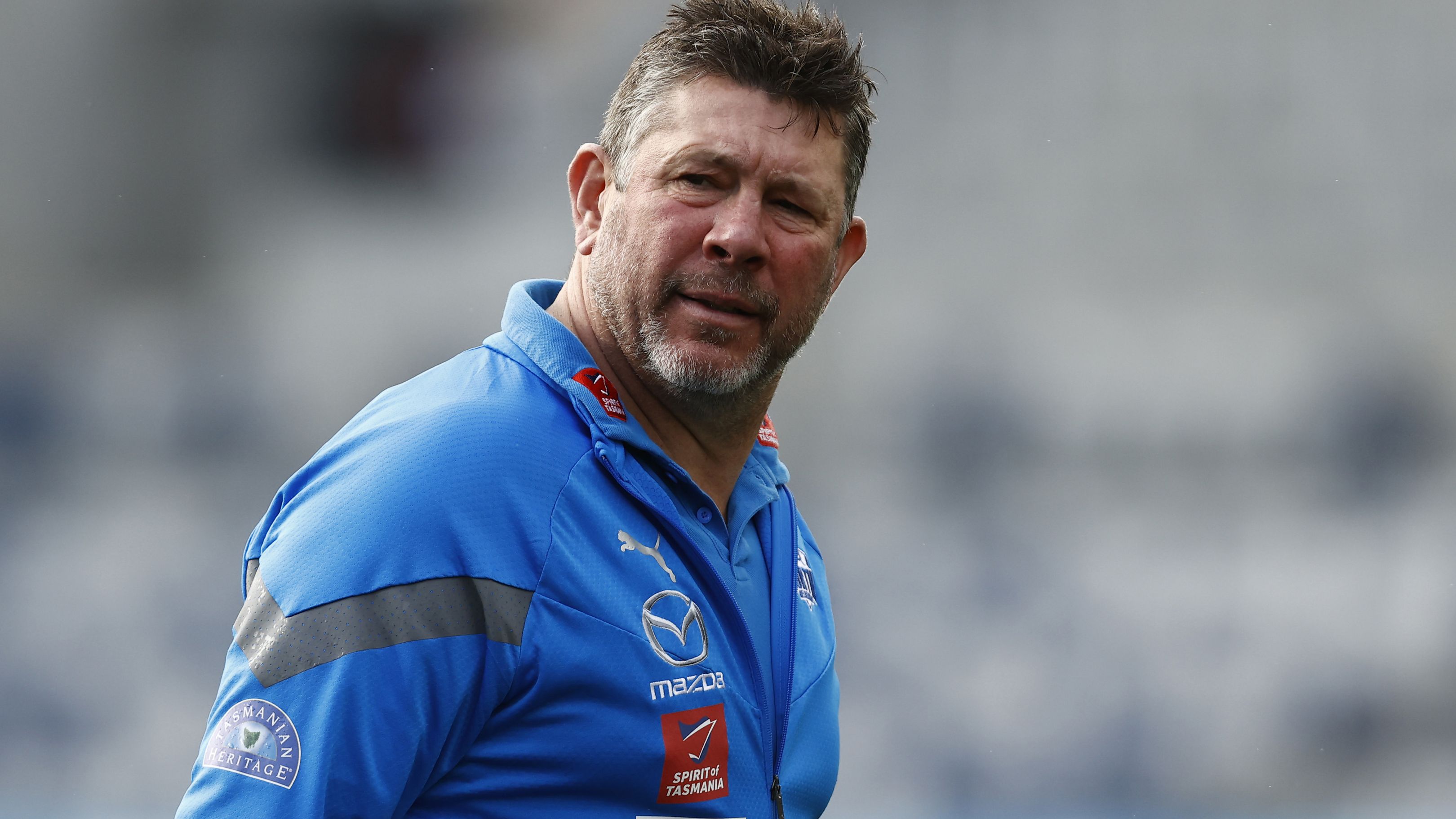 GEELONG, AUSTRALIA - JULY 09: Brett Ratten, North Melbourne caretaker coach looks on during the round 17 AFL match between Geelong Cats and North Melbourne Kangaroos at GMHBA Stadium, on July 09, 2023, in Geelong, Australia. (Photo by Darrian Traynor/Getty Images)
