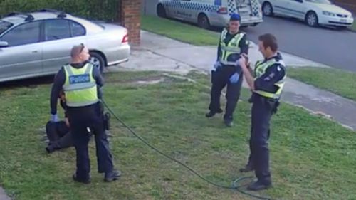 One of the officers is shown filming the incident as it unfolds. (Fairfax Media)