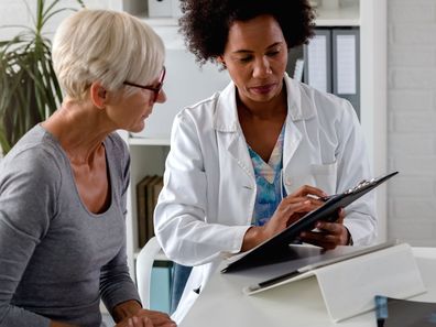 Woman having check-up with doctor.