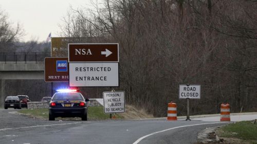 A shootout has erupted after a stolen SUV rammed the gates of the NSA headquarters. (AAP)