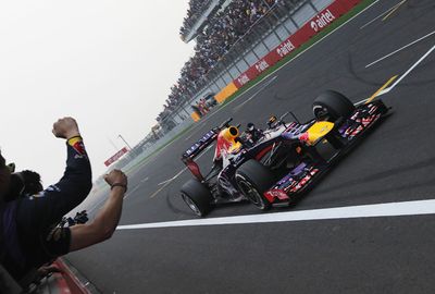 Vettel crosses the line to record his 10th Grand Prix victory of the season.