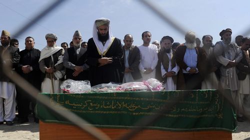 Mass grief for Afghan woman killed for allegedly burning Koran