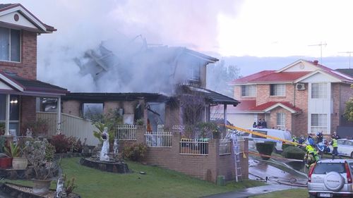 A major housefire is underway in Sydney's south-west where multiple people have narrowly escaped.