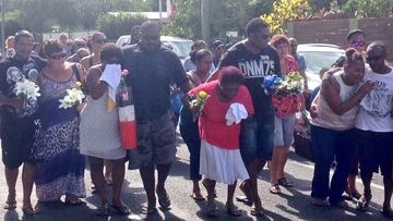 Family members arrive at the Manoora shrine in Cairns. (Tom Steinfort)