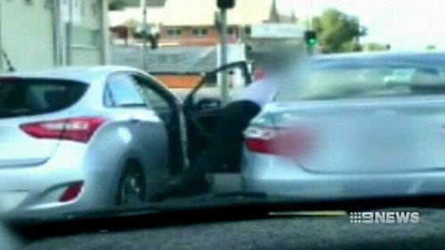 Horrified motorists watched on as the vicious brawl unfolded during this morning's peak-hour on West Terrace. (9NEWS)