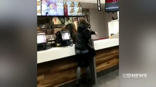 The woman was filmed throwing EFTPOS machines at frightened staff and shattering a nearby television screen. Picture: Supplied.