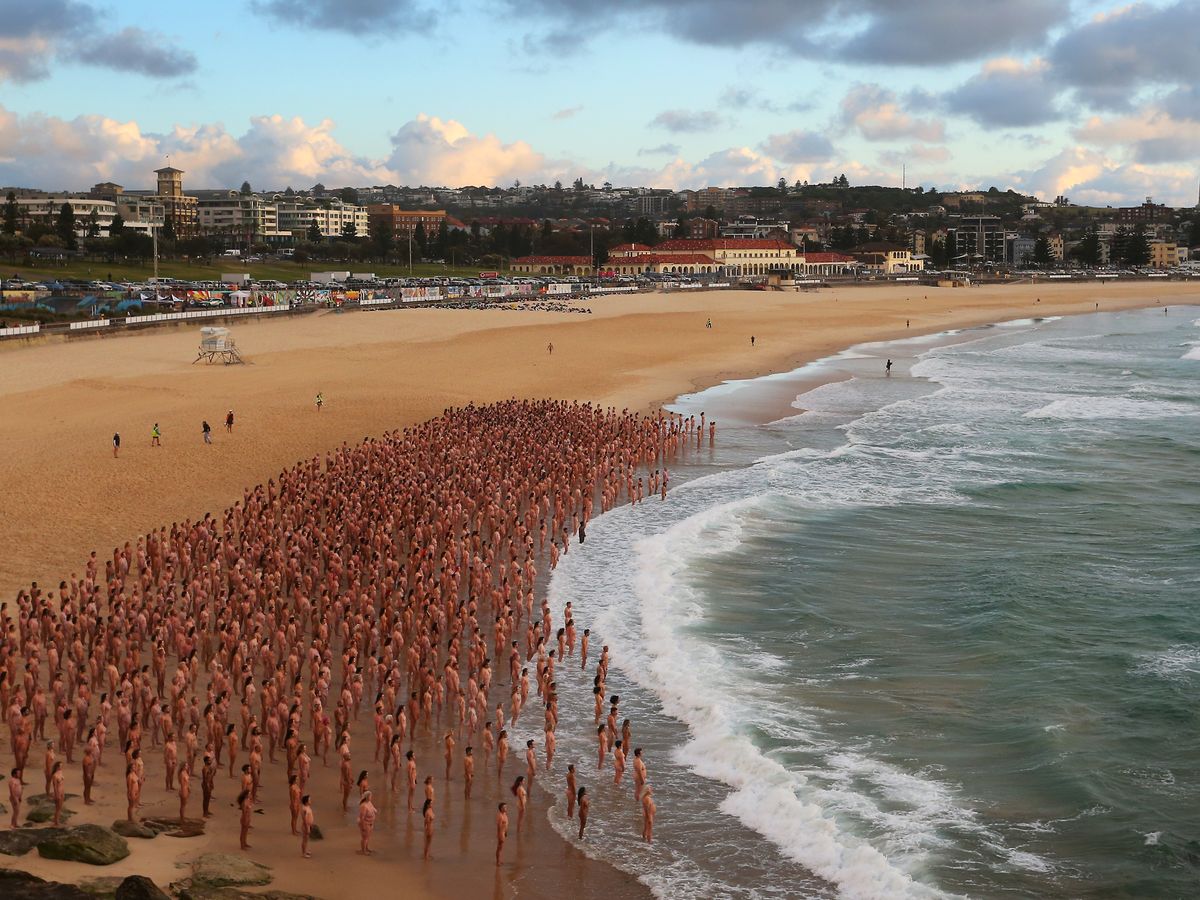 Thousands strip off at Bondi Beach for renowned photographer