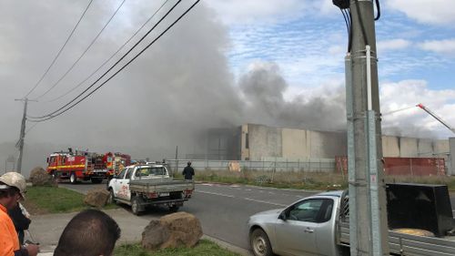 Smoke pouring from the factory in Campbellfield yesterday.