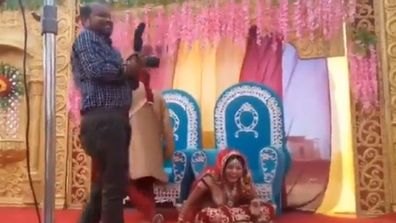 Bride's surprise response after groom strikes photographer during wedding