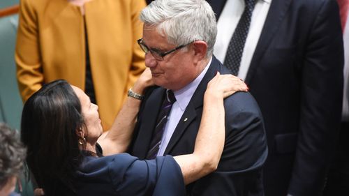 Linda Burney and Ken Wyatt embrace after her maiden speech to parliament in 2016.
