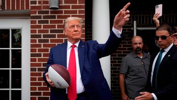 Donald Trump went to a college football game in the US.