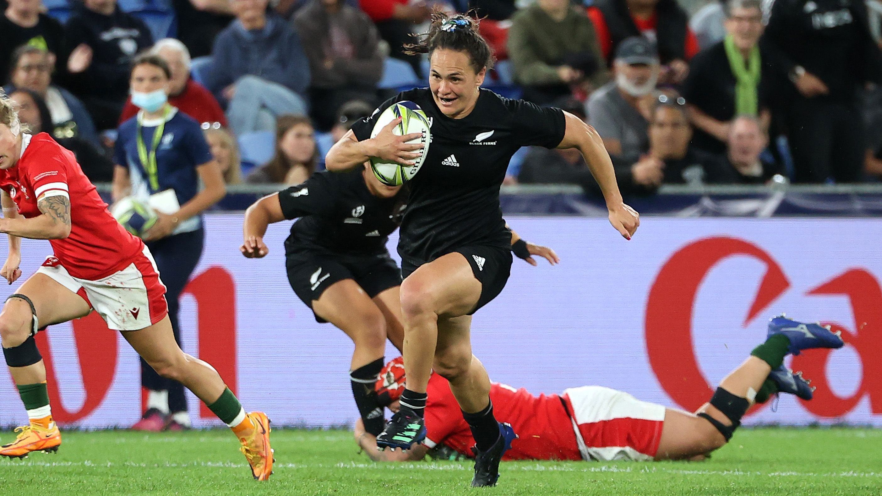 Portia Woodman of New Zealand runs the ball on her way to a try during the Rugby World Cup quarter-final against Wales.