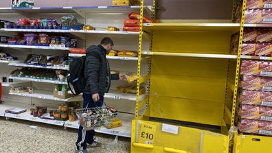 A man shopping at Tesco in London