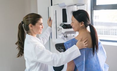 Woman undergoing mammogram test