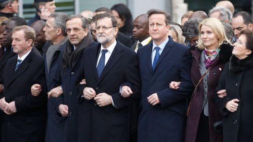 World leaders including (L-R) Irish Prime Minister Enda Kenny, NATO Secretary-General Jens Stoltenberg, Greek Prime Minister Antonis Samaras, Spanish Prime Minister Mariano Rajoy, British Prime Minister David Cameron, Danish Prime Minister Helle Thorning-Schmidt and Polish Prime Minister Ewa Kopacz walk at the start of a march to honor the victims of the terrorist attacks and to show unity. (AAP)