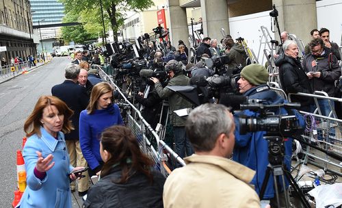 The media pack awaits news of the royal birth. (AAP)