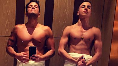 Peter Andre's son Junior Andre shared a photo of the pair in matching poses, wearing just a towel, for his dad's 50th Birthday