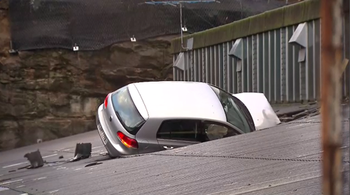 Staff were forced to run from the Leichhardt building amid fears the car could come crashing through the roof.