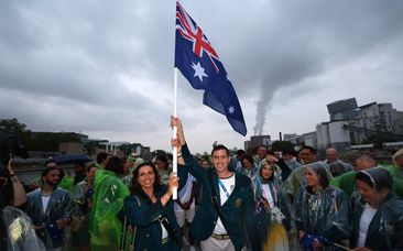 Soaked athletes fly Australia&#x27;s flag high