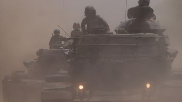 Soldiers on top of M60A3 tanks during a drill rehearsal in New Taipei City, Taiwan July 20, 2023. 