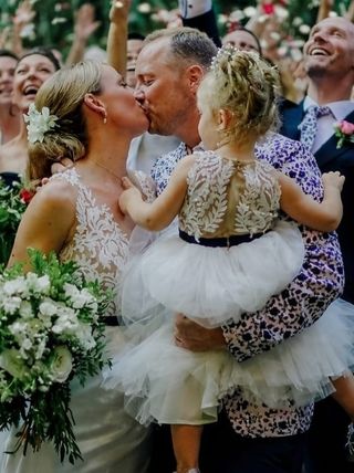 Mel Schilling with husband Gareth Brisbane and daughter Maddie on their wedding day.