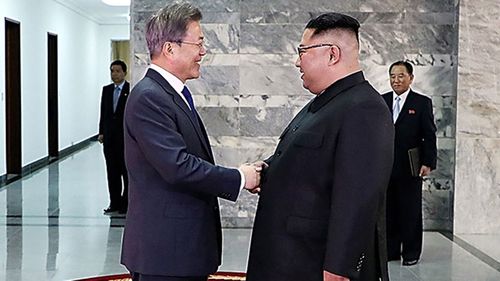 South Korea President Moon Jae-in (left) met with North Korean leader Kim Jong Un (right) in a surprise second summit on Saturday (Getty/Handout)