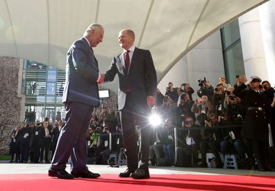 German Chancellor Olaf Scholz (R) welcomes Britain's King Charles III at the Chancellery on March 30, 2023 in Berlin, Germany. 