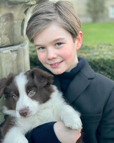 Prince Vincent is all smiles in the company of his puppy