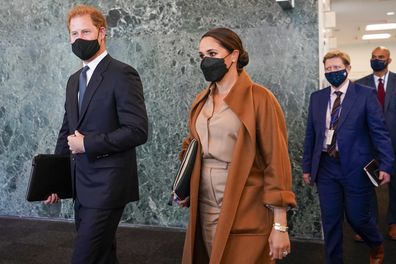 Prince Harry and Meghan, the Duke and Duchess of Sussex are escorted as they leave the United Nations headquarters after a visit during 76th session of the United Nations General Assembly, Saturday, Sept. 25, 2021. (AP Photo/Mary Altaffer)