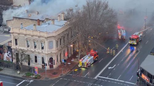 Police are investigating a "suspicious" fire tearing through the historic Oxford Hotel in north Adelaide.